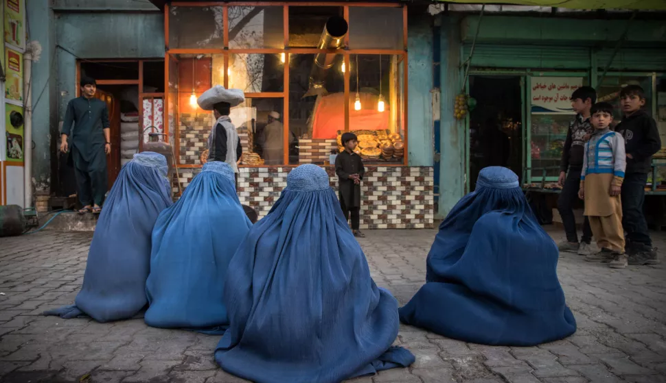 EDITORIAL USE ONLY - Burqa-clad Afghan women wait for donations of bread outside a Kabul bakery. The majority of them come here every day and wait three hours for a piece of bread. A loaf of bread costs 10 afghanis ($ 0.10) but they can't afford it. Afghanistan is on the verge of becoming the world's worst humanitarian crisis that could lead to unprecedented famine.. Afghanistan on November 14, 2021. Photo by Oriane Zerah/ABACAPRESS.COM