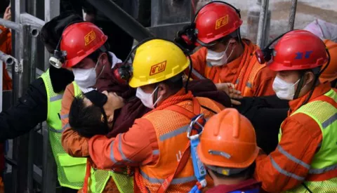 epa08961562 A picture released by Xinhua News Agency shows a trapped miner being lifted from a gold mine in Qixia City, east China's Shandong Province, 24 January 2021. The miner, who has been trapped underground for two weeks after a blast in a gold mine, was found by rescuers on 24 January morning that who is in extremely weak condition, was lifted from the mine at 11:13 a.m. on 24 January 2021. As many as twenty-two miners have been trapped about 600 meters underground since the mine blast on 10 January 2021 in Qixia, east China's Shandong Province. EPA/CHEN HAO/XINHUA -- MANDATORY CREDIT: XINHUA -- EDITORIAL USE ONLY/NO SALES