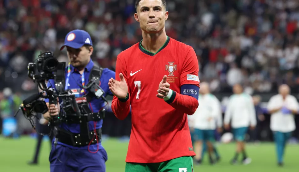 epa11451437 Cristiano Ronaldo of Portugal celebrate winning the penalty shoot-out after the UEFA EURO 2024 Round of 16 soccer match between Portugal and Slovenia, in Frankfurt Main, Germany, 01 July 2024. EPA/MOHAMED MESSARA