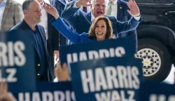 epa11554470 US Vice President and presumptive Democratic Presidential nominee Kamala Harris (R), her running mate Tim Walz (C) and Second Gentleman Doug Emhoff (L) greet supporters prior to a campaign bus tour at Pittsburgh International Airport in Pittsburgh, Pennsylvania, USA, 18 August 2024. A new CBS News national poll shows Vice President Harris with a narrow lead over former President Donald Trump. EPA/SHAWN THEW