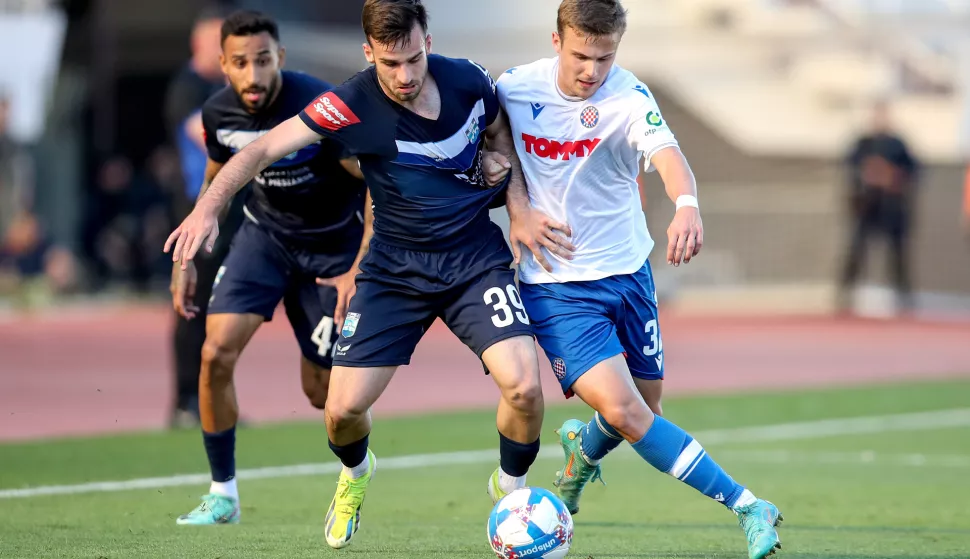 14.04.2024., stadion Poljud, Split - SuperSport HNL, 30. kolo, HNK Hajduk - NK Osijek. Domagoj Bukvic, Simun Hrgovic Photo: Sime Zelic/PIXSELL