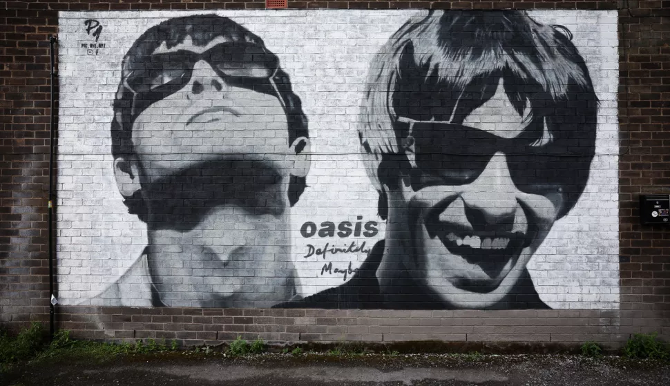 epa11570725 A mural of Liam and Noel Gallagher of British band Oasis is seen near Sifters Records in Manchester, Britain, 29 August 2024. The mural was painted by street artist Pic.One.Art in June 2024 to mark the 30th anniversary of the band's debut album, Definitely Maybe. Oasis have announced a number of live reunion concert dates in Cardiff, Manchester, London, Edinburgh, and Dublin, having reformed after a 15-year split. EPA/ADAM VAUGHAN