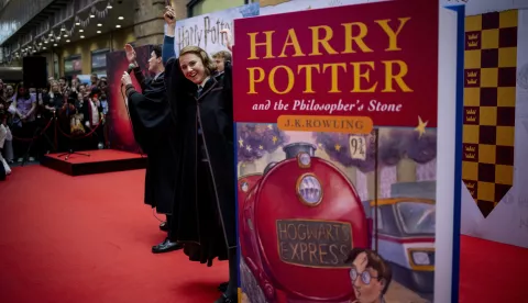 epa10152058 The cast of 'Harry Potter and The Cursed Child' perform for Harry Potter fans that gathered to celebrate the 25th anniversary of the first Harry Potter book's release at King's Cross station in London, Britain, 01 September 2022. The 'Back to Hogwarts' event also celebrates the 25th anniversary of the departure of the Hogwarts Express Platform Nine and Three Quarters depicted in 'Harry Potter and the Philosopher's Stone'. In the last 25 years J.K. Rowling's series has sold over 600 million copies worldwide, has been translated into more than 80 languages and turned into 8 films. EPA/TOLGA AKMEN