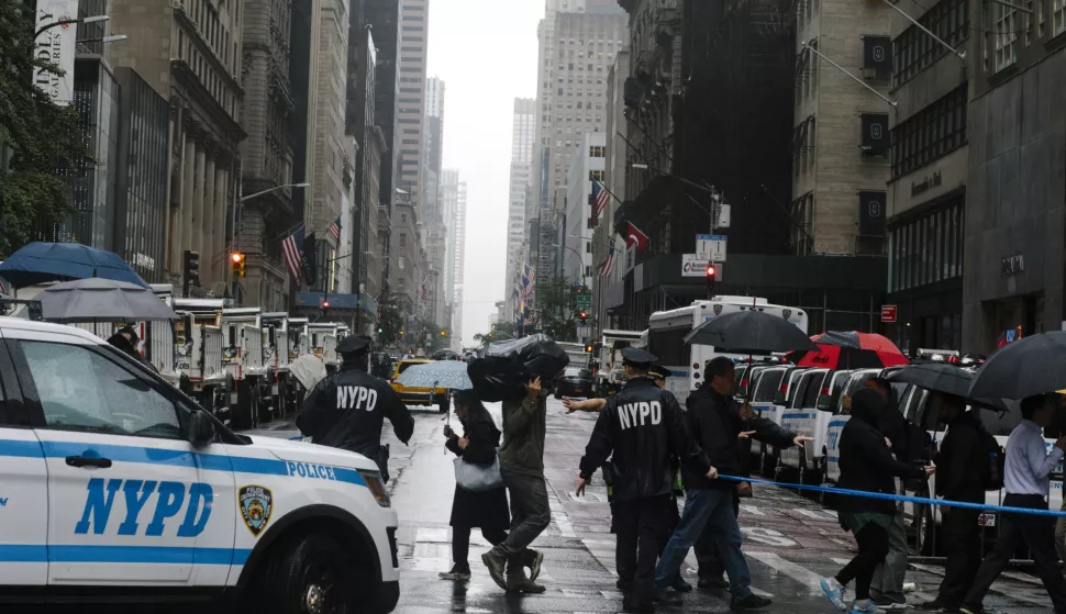 epa07047055 New York Police Department (NYPD) officers direct pedestrians to cross a street in gridlock near Trump Tower in New York, New York, USA, 25 September 2018. Media reports state that local authorities and the NYPD have boosed their security measures by channeling motor and pedestrians traffic in New York because of the US President being in town for the 73rd session of the General Assembly of the United Nations, at the United Nations Headquarters in New York. EPA/JOHN TAGGART