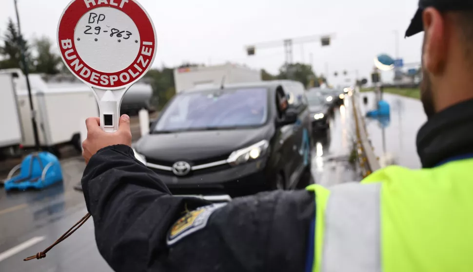 epa11607811 German police officer stops a car at a border crossing point between Germany and Austria in Walserberg, Germany, 16 September 2024. According to the German Federal Ministry of the Interior and Community, the temporary reintroduction of border control at Germany's land borders with France, Luxembourg, the Netherlands, Belgium and Denmark has been ordered for six months, starting 16 September 2024. EPA/ANNA SZILAGYI