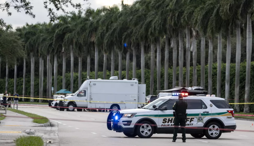 epa11606882 Palm Beach Sheriff officers guard the rear entrance of the Trump International Golf Club in West Palm Beach, Florida, USA on 15 September 2024, where gunshots were reported. According to the FBI, they are following an investigation of what appears to be an attempted assassination of Former President Donald Trump. Palm Beach County Sheriff Ric Bradshaw said the US Secret Service agents found a man pointing an AK-style rifle with a scope into the club as Trump was on the course. EPA/CRISTOBAL HERRERA-ULASHKEVICH