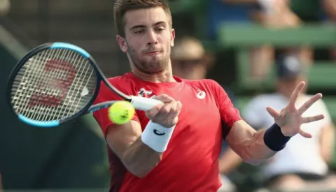 epa08126362 Borna Coric of Croatia in action against Grigor Dimitrov of Bulgaria during the Kooyong Classic at Kooyong Lawn Tennis Club in Melbourne, Australia, 14 January 2020. EPA/ROB PREZIOSO AUSTRALIA AND NEW ZEALAND OUT EDITORIAL USE ONLY