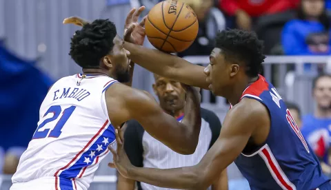 epa07272253 Philadelphia 76ers center Joel Embiid of Cameroon (L) in action against Washington Wizards center Thomas Bryant (R) during the first half of the NBA basketball game between the Philadelphia 76ers and the Washington Wizards at CapitalOne Arena in Washington, DC, USA, 09 January 2019. EPA/ERIK S. LESSER SHUTTERSTOCK OUT