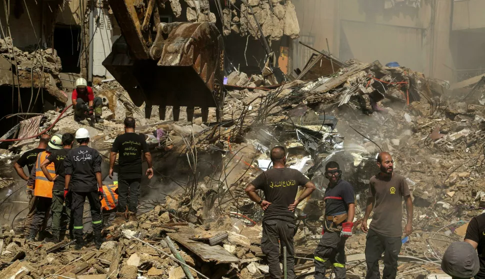 21 September 2024, Lebanon, Beirut: Civil Defense workers are seen at the site of the Israeli air raid attack in Beirut southern suburb. The death toll from the Israeli attack on Beirut's southern suburbs, a hotbed of the pro-Iranian Hezbollah movement, has risen to 31, authorities said on 21 September. Among the dead were three children and seven women, Lebanese Health Minister Firas Abiad said in a press conference. Photo: Marwan Naamani/dpa Photo: MARWAN NAAMANI/DPA