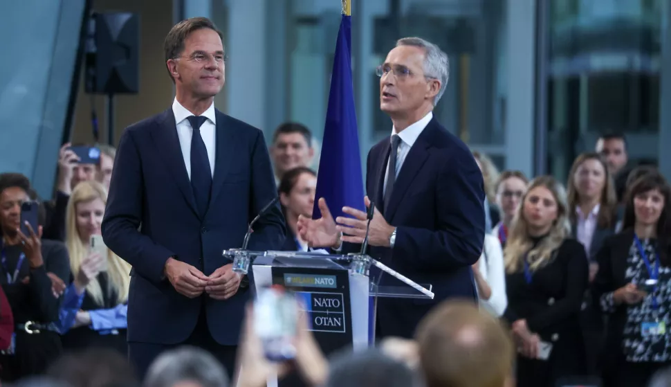 epa11634820 New NATO Secretary General Mark Rutte (L) and former Secretary General Jens Stoltenberg deliver short remarks to all staff at the Alliance headquarters in Brussels, Belgium, 01 October 2024. Former Dutch Prime Minister Mark Rutte succeeds Jens Stoltenberg as Secretary General of the North Atlantic Treaty Organization (NATO) on 01 October 2024 after the latter's ten years at the helm of the Alliance. EPA/OLIVIER HOSLET