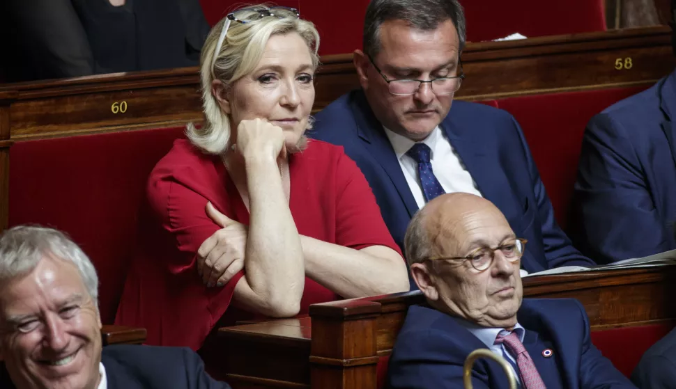 epa06920550 French member of parliament and president of the Rassemblement National far-right party Marine Le Pen (C) during a debate prior to a non-confidence vote against the government at the National Assembly in Paris, France, 31 July 2018. Parliamentary proceedings are disrupted by opposition MPs following the scandal of President Macron's security chief Alexandre Benalla after a video has been released on 19 July 2018 showing Benalla wearing a riot helmet and police uniform, allegedly attacking protesters during street demonstrations on 01 May 2018. EPA/CHRISTOPHE PETIT TESSON