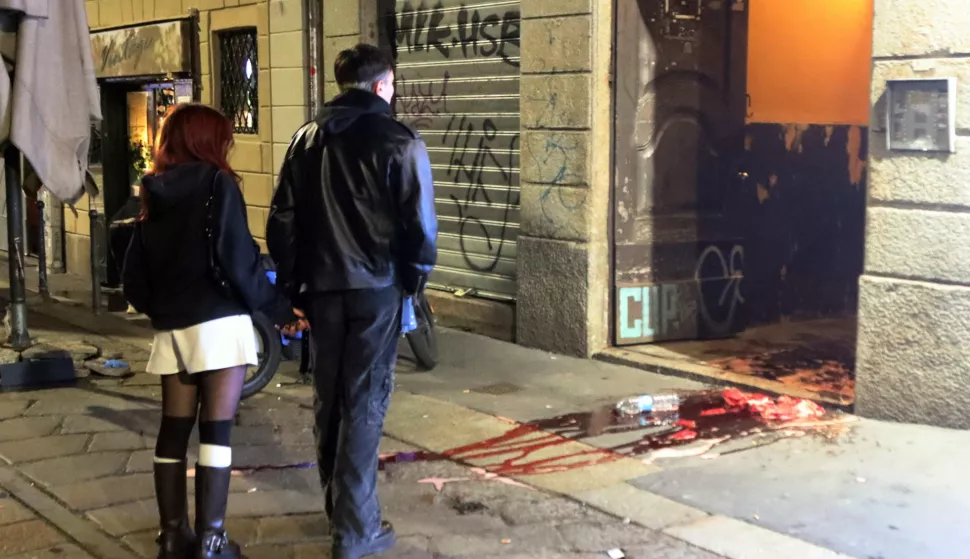 epa10961926 People gather at the scene of a late night fight between fans of local team AC Milan and French team PSG in the Navigli area of Milan, Italy, early 07 November 2023. During the outburst of violence, one French fan suffered non-life-threatening stabbing wounds and also two policemen were injured. AC Milan and PSG will play a Champions League match at the Meazza stadium in Milan later on 07 November. EPA/Paolo Salmoirago ATTENTION EDITORS: GRAPHIC CONTENT