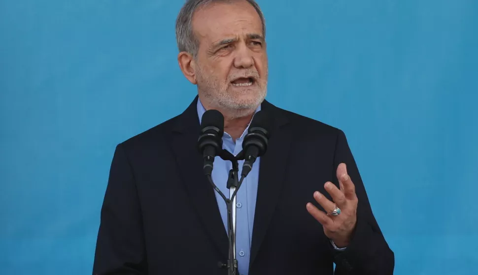 epa11616681 Iranian president Masoud Pezeshkian speaks during the annual military parade marking the Iraqi invasion in 1980, which led to an eight-year-long war (1980-1988); in Tehran, Iran, 21 September 2024. According to IRNA newes agency, Iranian president Masoud Pezeshkian said 'our defense system power is on that level that no enemy even dares to think to attack against Iran, and we will continue to develop our defense system in any aspects.' EPA/ABEDIN TAHERKENAREH