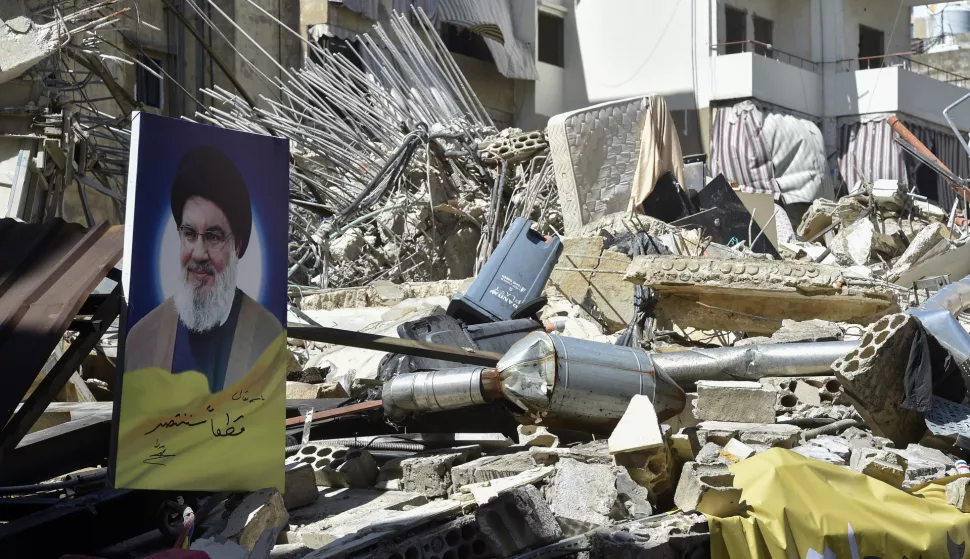 epa11637875 A picture taken during a press tour organized by the Hezbollah media office shows a photograph of late Hezbollah leader Hassan Nasrallah hanging on damaged building following an overnight Israeli military strike, in the southern suburbs of Beirut, Lebanon, 02 October 2024. According to the Lebanese National News Agency (NNA), Israeli warplanes conducted a series of raids against multiple neighborhoods in the southern suburbs of Beirut (Dahieh) on the evening of 01 October. On 30 September Israel announced the beginning of a 'limited, localized and targeted' ground operation against Hezbollah in southern Lebanon. EPA/WAEL HAMZEH