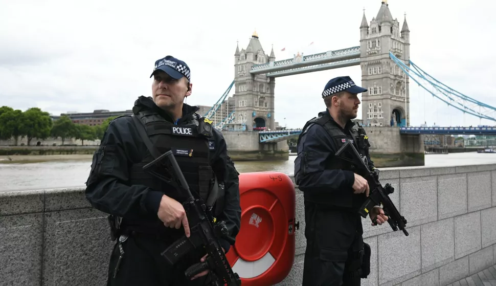 epa06369453 (FILE) - British police on dutyl during a vigil for the victims of the London Bridge terror attacks by the City Hall in London, Britain, 05 June 2017, (reissued 05 December 2017). Media reports on 05 December 2017 state that the report by David Anderson QC, a former terrorism law reviewer asked by the British Home Secretary to audit internal MI5 and police reviews, is published on 05 December 2017. The terror attacks in 2017 - at Manchester Arena, London Bridge, Finsbury Park and Westminster - has placed the spotlight on the British security services. The British internal security service MI5 and police launched internal reviews following the atrocities between March and June 2017 and the findings of the reviews looking at intelligence handling by the organisations are to be seen in the review published by the Home Secretary. EPA/FACUNDO ARRIZABALAGA *** Local Caption *** 53568746