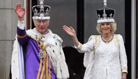 epaselect epa10612353 Britain's King Charles III (L) and Queen Camilla wave from the balcony of Buckingham Palace following their Coronation in London, Britain, 06 May 2023. The appearance on the balcony is to greet the crowds who have gathered in The Mall and to watch a fly past. EPA/Neil Hall