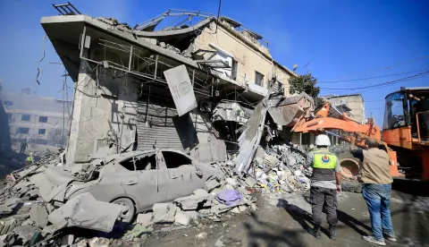 epa11657130 Rescuers work at the site of destroyed buildings following an Israeli military strike on a commercial market in Nabatieh, southern Lebanon, 13 October 2024. According to Lebanon's National News Agency (NNA), Israeli warplanes targeted the center of the commercial market in the city of Nabatieh on the evening of 12 October, injuring eight people and destroying several buildings. The Lebanese Health Ministry states that more than 2,255 people have been killed and over 10,500 others have been injured in Lebanon since the beginning of the Israeli-Hezbollah conflict. EPA/STRINGER