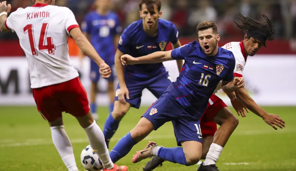 Varšava, 15.10.2024 - Utakmica 4. kola Lige nacija između reprezentacija Poljske i Hrvatske na stadionu Narodowy u Varšavi. Na slici Martin Baturina, Ante Budimir, Maximillian Oyedele, Jakub Kiwior.foto HINA/ Danijel KASAP/ ds