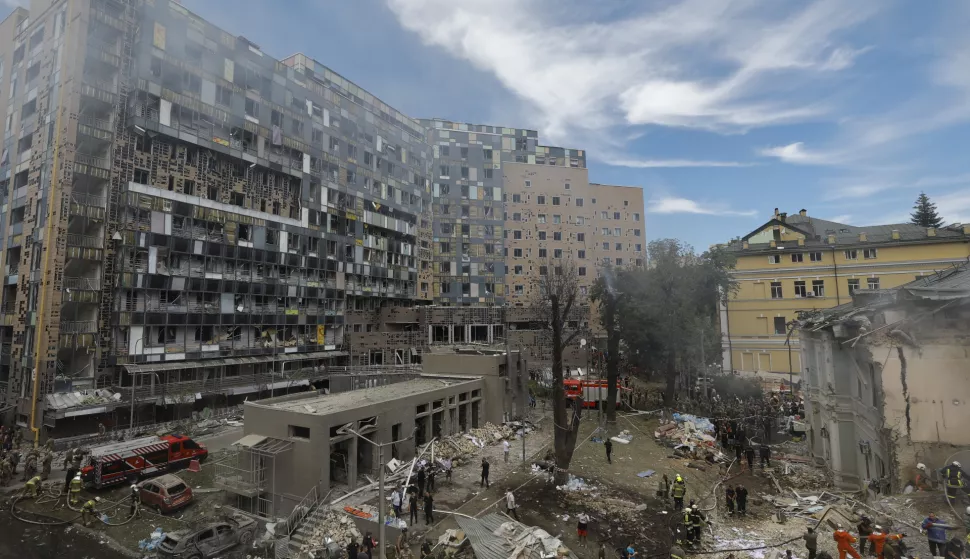 epa11466556 Ukrainians working at the site of a rocket strike on the 'Okhmadyt' children's hospital in Kyiv, Ukraine, 08 July 2024 amid the undoing Russian invasion. Russia massively attacked Ukraine with missiles 08 July, striking Kyiv, Dnipro, Kryvyi Rih, Sloviansk and Kramatorsk. More than 40 missiles of different types were launched, striking residential buildings, infrastructure and the children's hospital. At least seven people were killed and 25 injured as result of shelling in Kyiv according to the State Emergency Service report. EPA/SERGEY DOLZHENKO