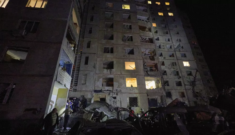 epa11618548 Ukrainian rescuers work at the site of overnight shelling on a multi-story residential building in Kharkiv, northeastern Ukraine, 21 September 2024 (issued 22 September 2024), amid the Russian invasion. At least 21 people have been injured, including three children, after Russian shelling hit a residential area in Kharkiv, the head of the Kharkiv Military Administration Oleg Synegubov wrote on telegram on 22 September. Russian troops entered Ukrainian territory on 24 February 2022, starting a conflict that has provoked destruction and a humanitarian crisis. EPA/SERGEY KOZLOV