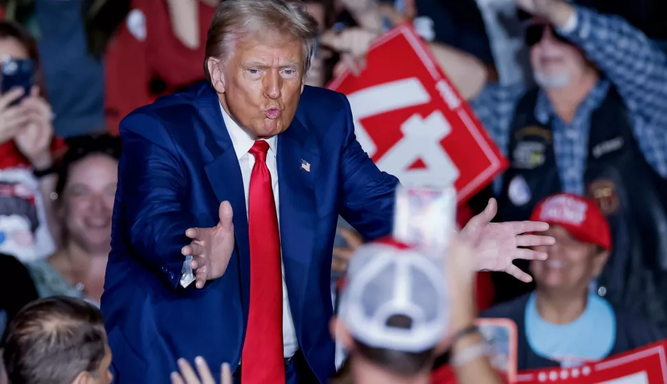 epa11676515 Former US president and Republican presidential nominee Donald Trump reacts at the conclusion of a campaign rally at the Greensboro Coliseum in Greensboro, North Carolina, USA, 22 October 2024. Trump is running against Democratic US Vice President Kamala Harris. EPA/ERIK S. LESSER