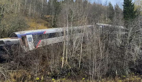 epa11680034 Aftermath of a train derailment in Finneidfjord, Nordland municipality, Norway, 24 October 2024. According to police, at least one person died and several others were injured when the train carrying at least 50 passengers derailed in the afternoon of 24 October. Preliminary investigation suggests the derailment was caused by a rockslide. EPA/Jan Kenneth Transeth NORWAY OUT