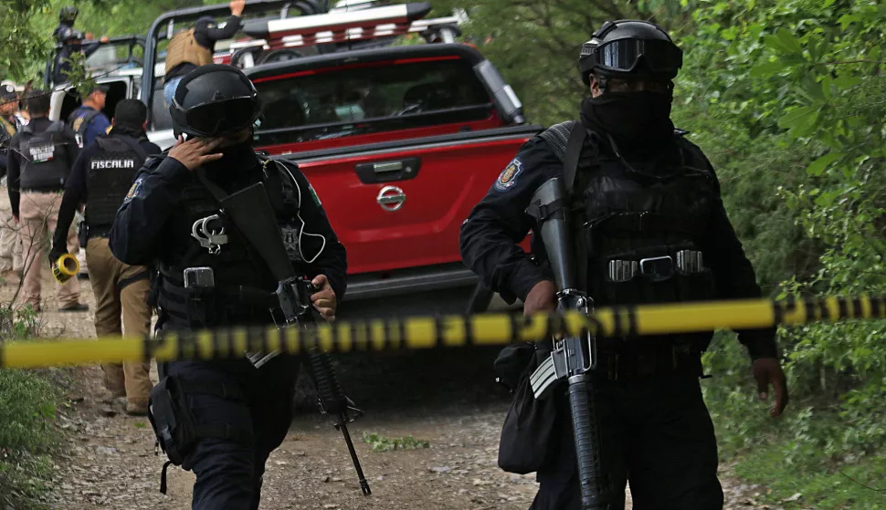 epa10770738 Members of the Guerrero State Attorney General's Office (FGE) monitor the area where a shooting took place in the municipality of Eduardo Neri, Mexico, 26 July 2023. At least four police officers were killed in the central zone of the state of Guerrero, southern Mexico, in a shootout with criminal groups, which occured after an operation in which they apprehended alleged criminals, local authorities reported. EPA/JosĂŠ Luis de la Cruz