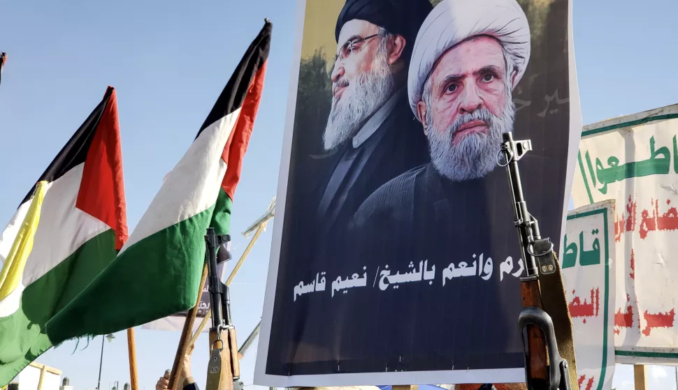 epa11695842 Houthi supporters hold a placard showing Hezbollah new leader Naim Qassem (R) and late Hezbollah leader Hassan Nasrallah (L) during a rally, in Sana'a, Yemen, 01 November 2024. Yemenis gathered for a rally in solidarity with the Lebanese and Palestinian people amid Israel's military operations in Lebanon and the Gaza Strip. Yemen's Houthis have launched missile and drone attacks against 202 vessels in the seas around Yemen since November 2023 in retaliation for Israel's military operations in Gaza and Lebanon, the Houthis' leader Abdul-Malik al-Houthi said in a televised speech on 31 October. EPA/YAHYA ARHAB