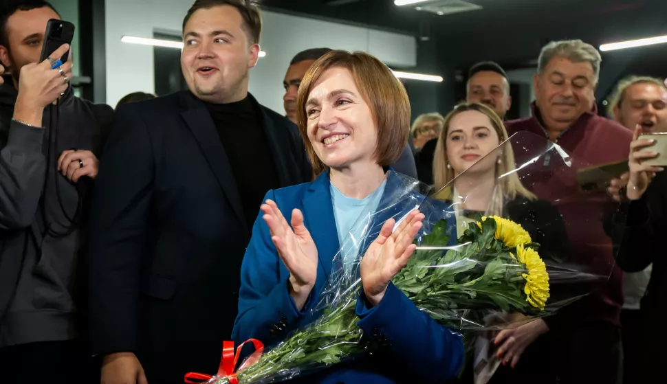 epa11699973 The incumbent President of Moldova Maia Sandu flanked by her supporters following the announcement of the preliminary election results at her campaign headquarters in Chisinau, Moldova, 03 November 2024. Moldova is holding the second round of presidential elections, with former Attorney General of Moldova Alexandr Stoianoglo facing incumbent President of Moldova Maia Sandu. EPA/DUMITRU DORU