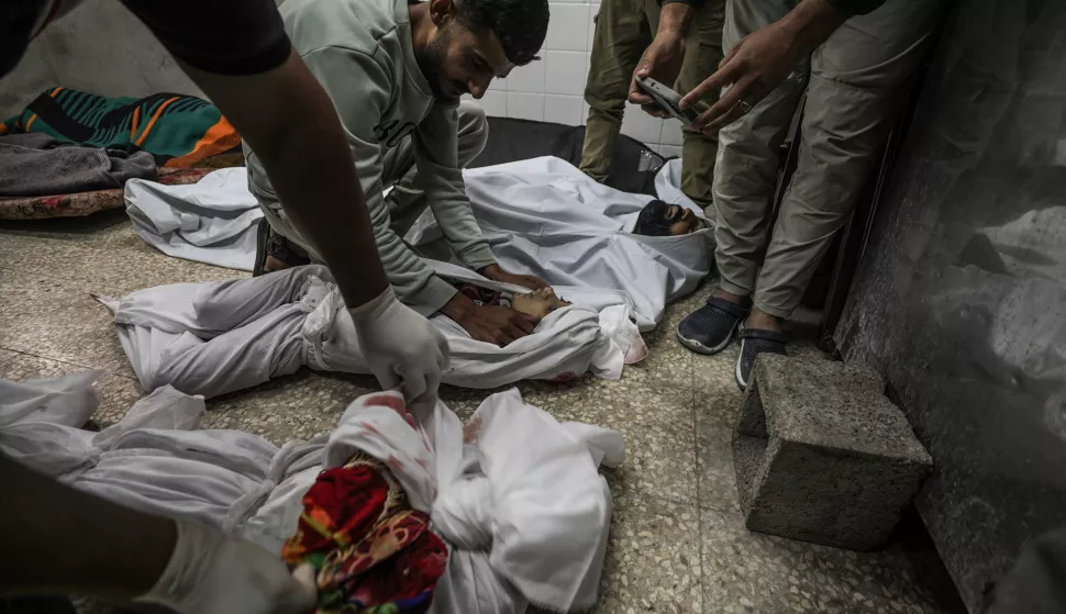 epa11695099 Relatives mourn at the morgue of Al Aqsa Martyrs hospital in Deir Al Balah town, central Gaza Strip, 31 October 2024. According to the Palestinian Ministry of Health in Gaza, at least 16 Palestinians were killed in an Israeli airstrikes in Al Nusairat refugee camp central Gaza strip. More than 43,000 Palestinians and over 1,400 Israelis have been killed, according to the Palestinian Health Ministry and the Israel Defense Forces (IDF), since Hamas militants launched an attack against Israel from the Gaza Strip on 07 October 2023, and the Israeli operations in Gaza and the West Bank which followed it. EPA/MOHAMMED SABER ATTENTION EDITORS: GRAPHIC CONTENT