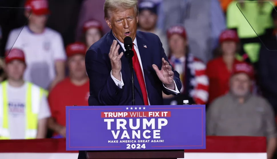 epa11702025 Republican presidential candidate and former US President Donald Trump gestures as he speaks during a campaign rally in Grand Rapids, Michigan, USA, 04 November 2024. Trump and Vice President and Democratic presidential nominee Kamala Harris are tied in the polls with one day until the election of 05 November. EPA/CJ GUNTHER