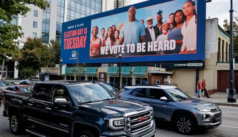 epa11698083 Motorists pass a billboard encouraging voting on Election Day, in downtown Atlanta, Georgia, USA, 02 November 2024. Republican former US president Donald Trump is running against Democratic US Vice President Kamala Harris. US Election Day is 05 November 2024. EPA/ERIK S. LESSER