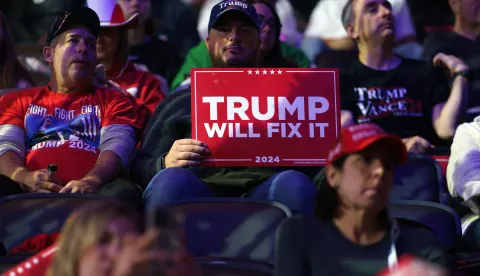 epaselect epa11701301 Supporters wait for former US President Donald Trump to attend a rally in Reading, Pennsylvania, USA, 04 November 2024. Trump and US Vice President and Democratic presidential candidate Kamala Harris are tied in the polls ahead of the US presidential election on 05 November. EPA/WILL OLIVER