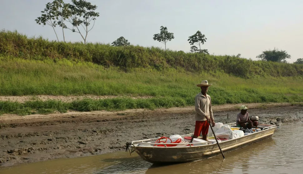 In Santa Maria do Tapara, Ruitilson Almeida Batista, a 62-year-old fisherman, fetches water from the Santana well for three families in his village. Between September and November 2023, the Amazon experienced an unprecedented drought. Fires ravaged flora and fauna, and many communities were cut off from the rest of the world, ?world, as to navigate they rely on waterways that had dried up. (Photo by Apolline Guillerot-Malick/SOPA Images/Sipa USA) Photo: SOPA Images/SIPA USA