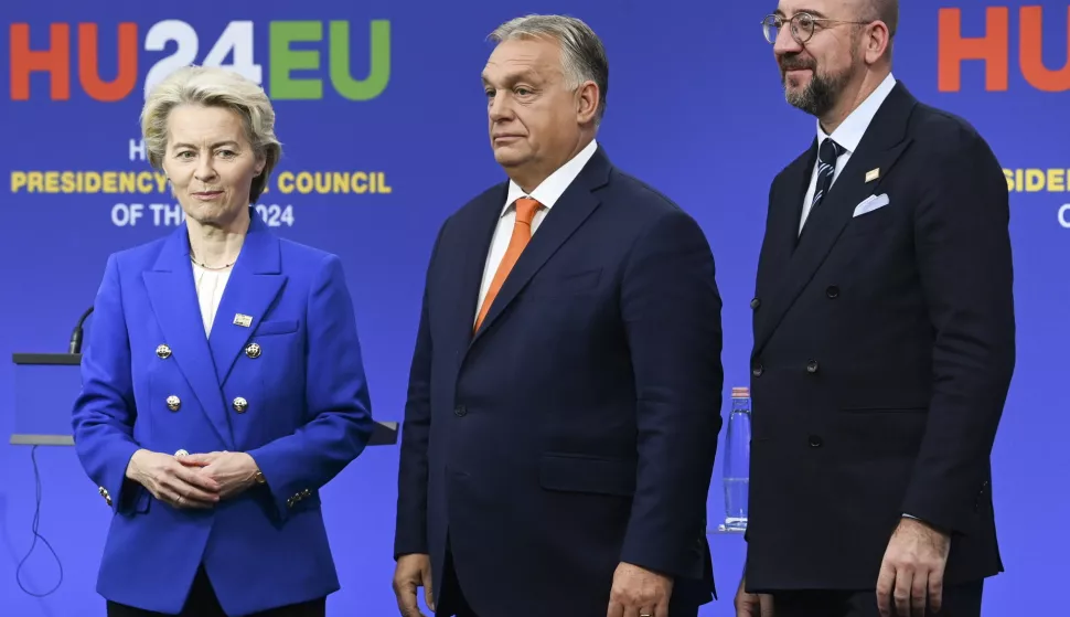 epa11710221 (L-R) European Commission President Ursula von der Leyen, Hungarian Prime Minister Viktor Orban and European Council President Charles Michel pose for photos at the end of a press conference following an informal summit of the European Council in Puskas Arena in Budapest, Hungary, 08 November 2024. EPA/ZOLTAN MATHE HUNGARY OUT