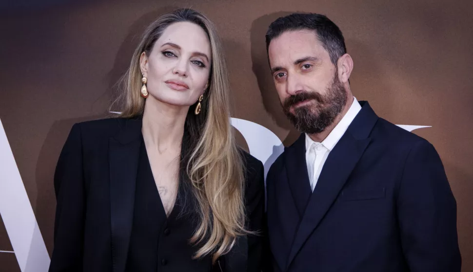 epa11667190 US actor Angelina Jolie (L) and Chilean director Pablo Larrain (R) pose on the red carpet as she arrives for the premiere of the film 'Maria' at the BFI London Film Festival, in London, Britain, 18 October 2024. The 68th edition of the annual film festival runs from 09 to 20 October 2024. EPA/TOLGA AKMEN