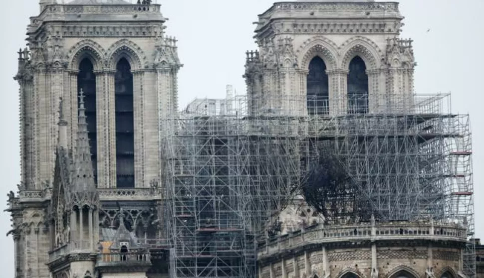 epa07509267 A view of the scaffolding after a massive fire destroyed the roof of the Notre-Dame Cathedral in Paris, France, 16 April 2019. A fire started in the late afternoon on 15 April in one of the most visited monuments of the French capital. EPA/IAN LANGSDON