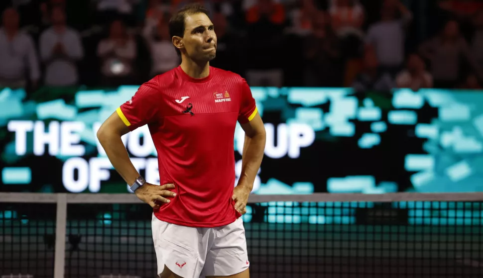 epa11730097 Rafa Nadal of Spain reacts during a tribute received after the Spanish doubles match against the Netherlands during the Davis Cup quarterfinal between Netherlands and Spain at the Jose Maria Martin Carpena Sports Palace in Malaga, Spain, 19 November 2024. EPA/JORGE ZAPATA