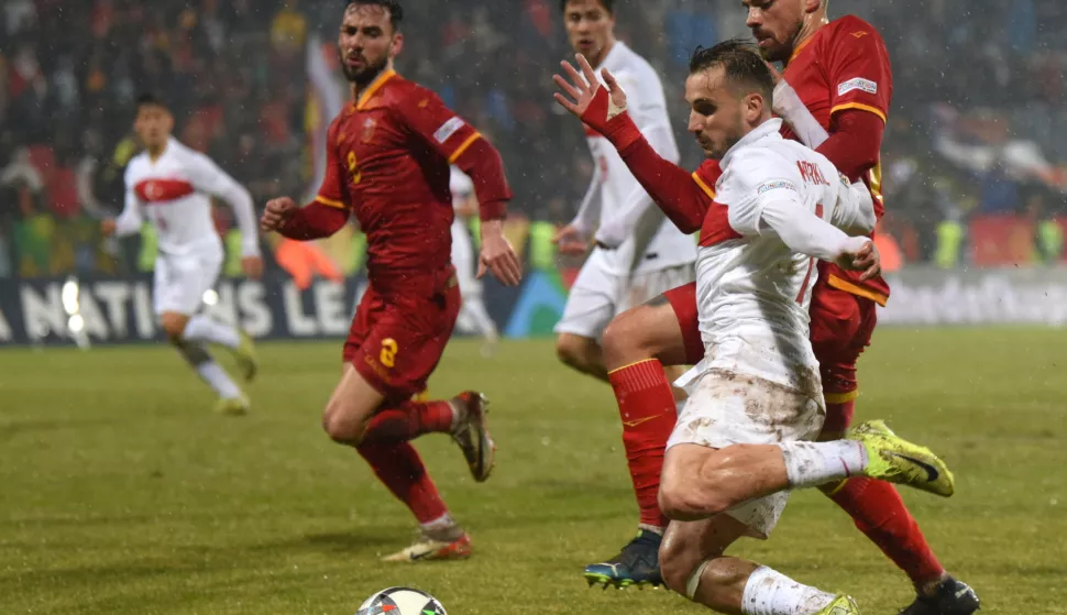 epa11729928 Turkey's Kerem Akturkoglu (L) in action against Montenegro's Marko Tuci (R) during the UEFA Nations League match between Montenegro and Turkey in Niksic, Montenegro, 19 November 2024. EPA/BORIS PEJOVIC