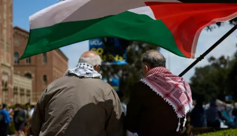 epa11301414 Two men wave the Palestinian flag as University of California Los Angeles (UCLA) students set up a Gaza solidarity encampment on campus to advocate for Palestine in Los Angeles, California, USA, 25 April 2024. More than 34,000 Palestinians and over 1,450 Israelis have been killed, according to the Palestinian Health Ministry and the Israel Defense Forces (IDF), since Hamas militants launched an attack against Israel from the Gaza Strip on 07 October 2023, and the Israeli operations in Gaza and the West Bank which followed it. EPA/ALLISON DINNER