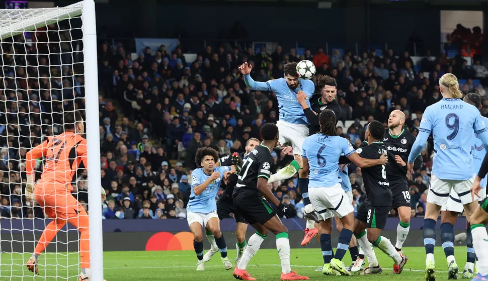 epa11742471 Josko Gvardiol of Manchester City (C) heads the ball during the UEFA Champions League match between Manchester City and Feyenoord in Manchester, Britain, 26 November 2024. EPA/ADAM VAUGHAN