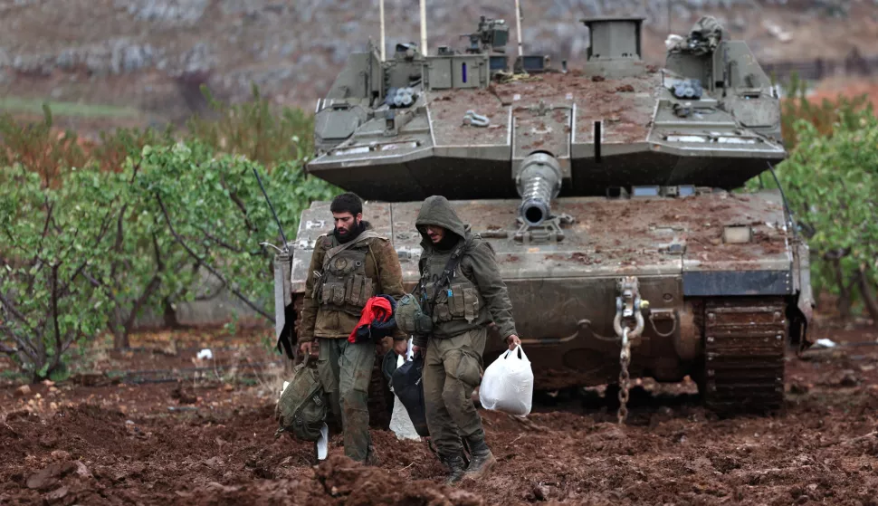 epa11742986 Israeli troops and tanks return to Israel after leaving Lebanon following a ceasefire, as seen from an undisclosed location in the Upper Galilee, Israel, 27 November 2024. On the evening of 26 November the US president confirmed that a ceasefire agreement between Israel and the Lebanese group Hezbollah - brokered by the United States and France - had been approved by Israel's cabinet and would come into effect at 02:00 GMT on 27 November. EPA/ATEF SAFADI