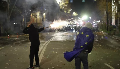 epaselect epa11747056 A Georgian opposition supporter launches fireworks towards the police during protest in front of the Parliament building in Tbilisi, Georgia, 29 November 2024. Georgian Prime Minister Irakli Kobakhidze said on 28 November that Tbilisi will refuse EU accession talks until 2028. On 26 October 2024, parliamentary elections were held in Georgia. Around 20 parties competed for seats in the country's highest legislative body, which comprises 150 deputies. The ruling Georgian Dream Party was announced as the winner of the parliamentary elections. EPA/DAVID MDZINARISHVILI