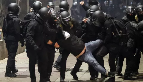 epa11755464 Police officers detain a protester during Georgian opposition supporters protest in front of the Parliament building in Tbilisi, Georgia, 03 December 2024. Thousands of pro-EU activists continue their protests in the Georgian capital against the country's ruling party decision to suspend accession talks with the European Union (EU) until the end of 2028. EPA/DAVID MDZINARISHVILI