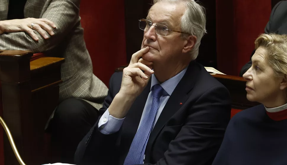 epa11756867 French Prime Minister Michel Barnier (C) listens to the speeches as his government faces a no-confidence vote at the National Assembly, in Paris, France, 04 December 2024. The no-confidence vote comes after the French prime minister activated Article 49.3 of the Constitution to pass his social security budget bill without a vote, as a majority of members of Parliament rejected his project on 02 December 2024. EPA/YOAN VALAT