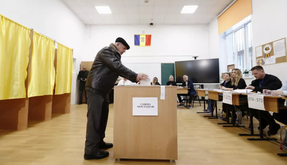 epaselect epa11751057 An elderly man casts his ballot at a polling station in Mogosoaia, Romania, 01 December 2024. Approximately 18 million Romanian citizens are expected at the polling stations this weekend for choosing the bicameral parliament members, according to the Permanent Electoral Authority (AEP), of which 989,230 people can express their intention abroad. EPA/ROBERT GHEMENT