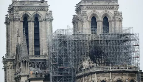 epa07509267 A view of the scaffolding after a massive fire destroyed the roof of the Notre-Dame Cathedral in Paris, France, 16 April 2019. A fire started in the late afternoon on 15 April in one of the most visited monuments of the French capital. EPA/IAN LANGSDON