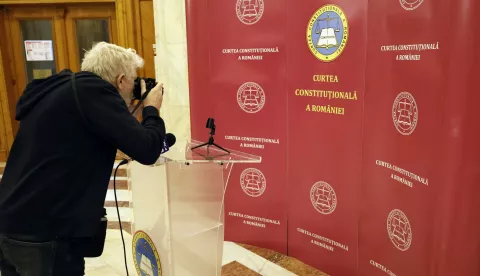 epa11760516 A photographer takes a snapshot of the empty speaker's desk shortly after the end of the Romanian Constitutional Court (CCR) debate regarding the results of the first round of the presidential elections, at the CCR headquarters in Bucharest, Romania, 06 December 2024. CCR board of judges on 06 December announced the annulment of the first round of the presidential elections. According to the CCR, the government will set a new date for the presidential elections, and the entire electoral process will be restarted, starting with the registration and validation of all candidates. EPA/ROBERT GHEMENT