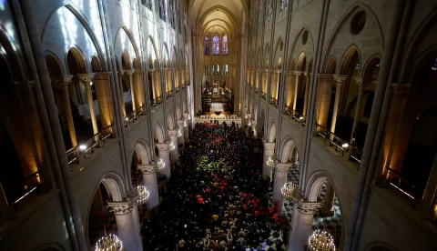 epa11747523 French President Emmanuel Macron delivers a speech (C) during a visit of Notre-Dame de Paris cathedral in Paris, France, 29 November 2024. French President Macron is visiting the cathedral's construction site on 29 November, to thank the donors and people who worked to rebuild the monument after it was severely damaged in a fire that broke out on 15 April 2019. The Paris Cathedral will be officially inaugurated after nearly six years of renovation work on 07 December 2024. EPA/SARAH MEYSSONNIER/POOL MAXPPP OUT