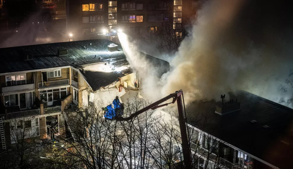 epa11761568 Emergency services try to extinguish a fire after a fire and an explosion at a residential building, in The Hague, the Netherlands, 07 December 2024. The explosion blew away several apartments. EPA/JOSH WALET